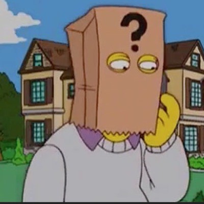 Animated Pynchon on the Simpsons wearing a paperbag over his head with two eye holes and a big question mark on the front