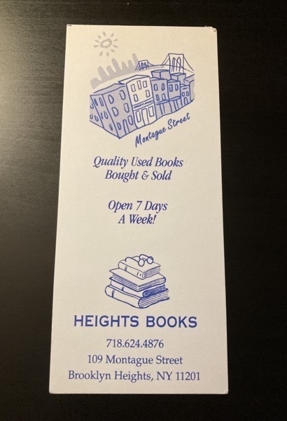 bookmark with a line drawing of the building with the Brooklyn Bridge in the background and another drawing of a stack of books