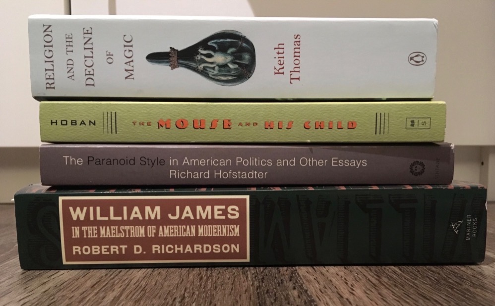 The spines of four books - Thomas: Religion and the Decline of Magic; Hoban: The Mouse and His Child; Hofstadter: The Paranoid Style in American Politics; Richardson: William James, In the Maelstrom of American Modernism