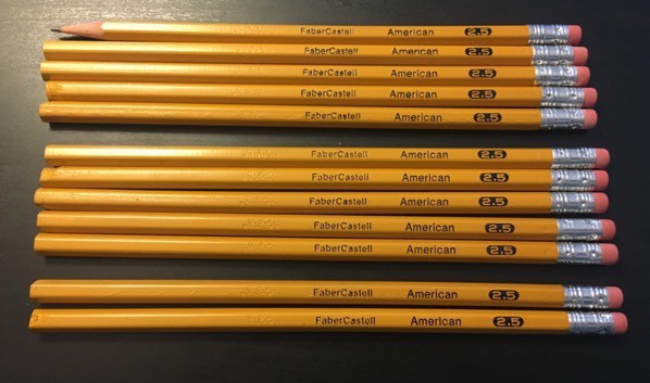 eleven unsharpened and one sharpened American 2.5 pencils