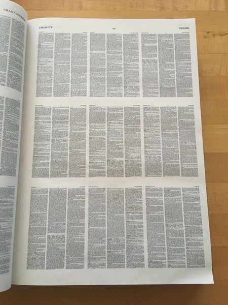 a page of the Compact OED showing nine pages on a single page in extremely tiny print