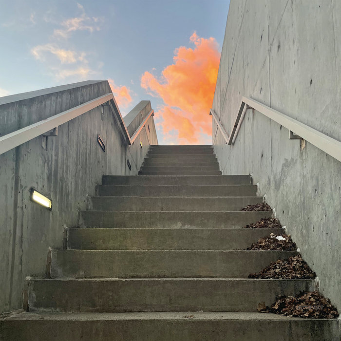 Cover image for the album Melt by Blank Gloss, showing a brutalist concrete staircase from below, and beyond is a pale blue sky with a soft pink cloud