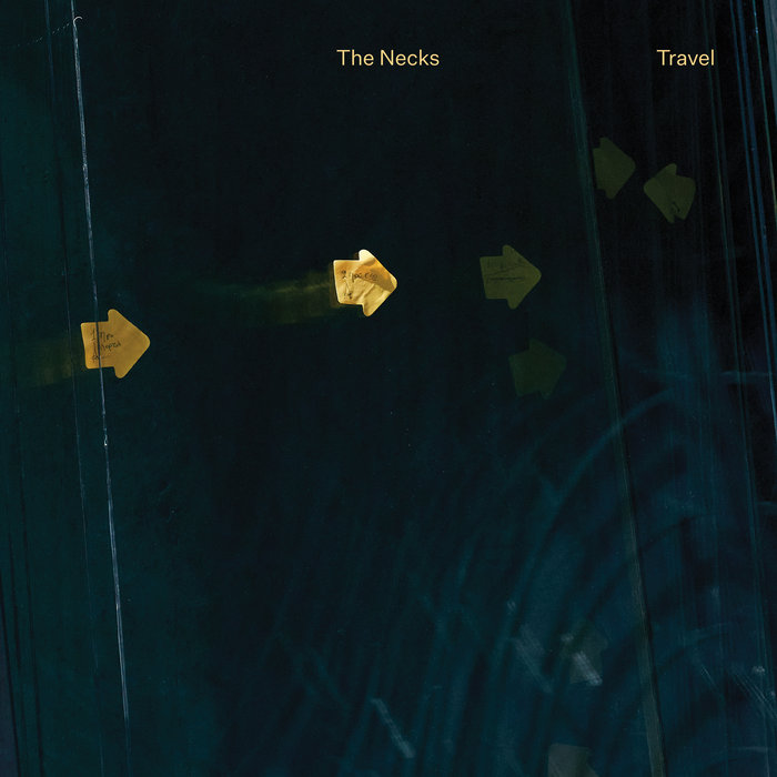 cover image for the album Travel by the Necks, showing a dark blue field with several gold arrows pointing mostly to the right but with a few faint images pointing left